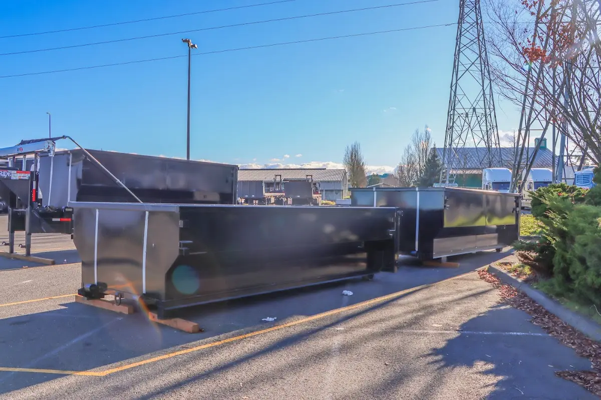 Roll-off dumpster ready for waste disposal at job site for Concrete Dumpster Rental in West Modesto